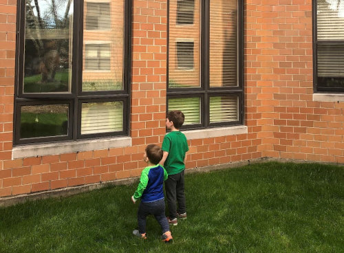 Emily’s sons visiting their great-grandparents at their independent living community in Wilmette.